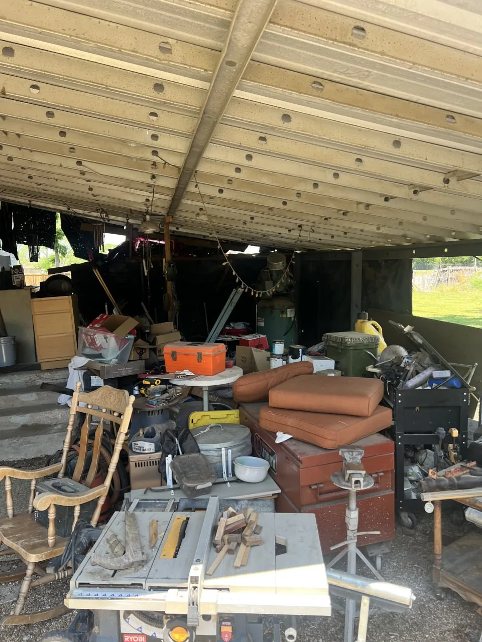 Cluttered garage before a Reset project