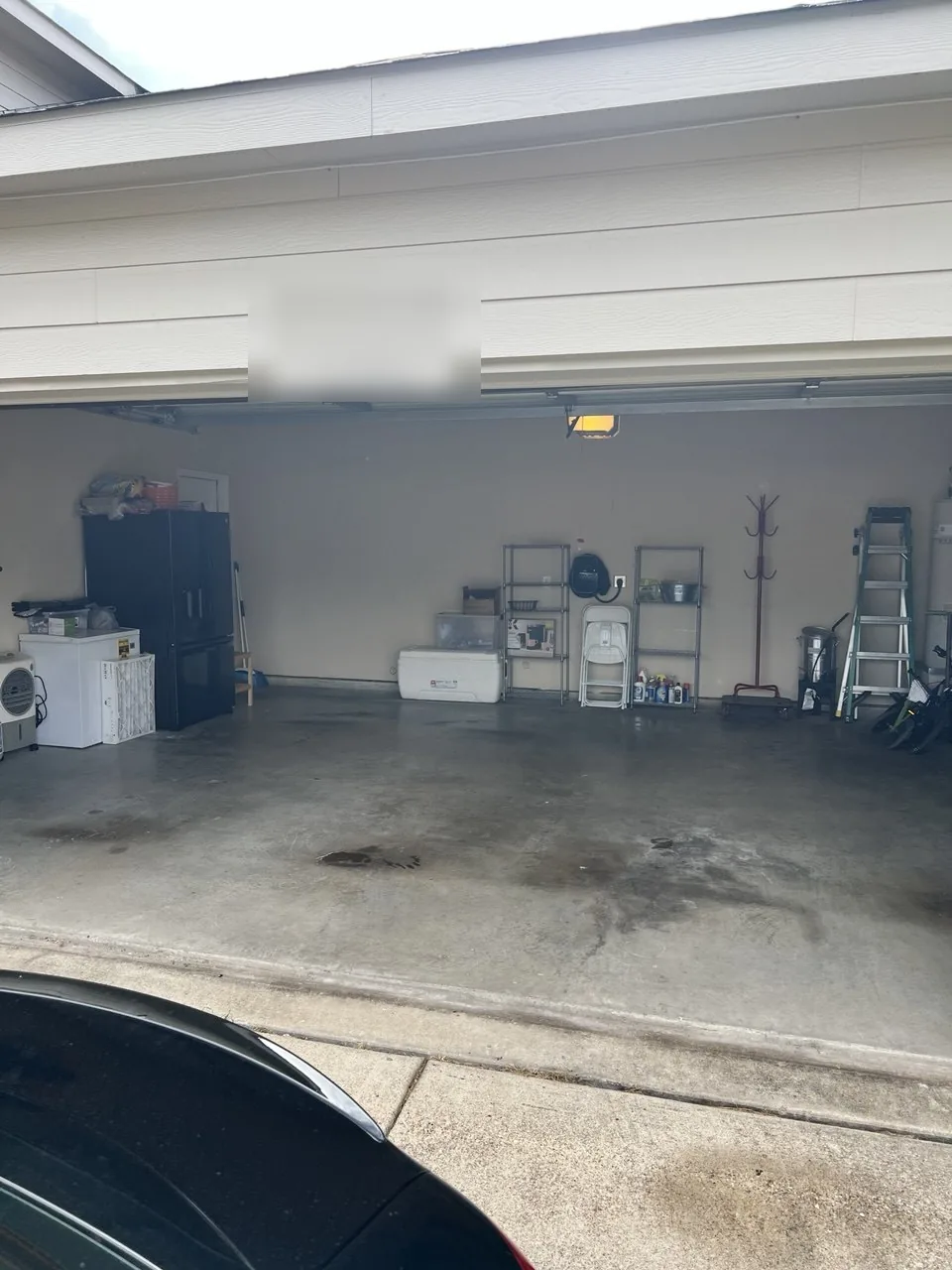 Two-car garage reset with open floor space and storage zones